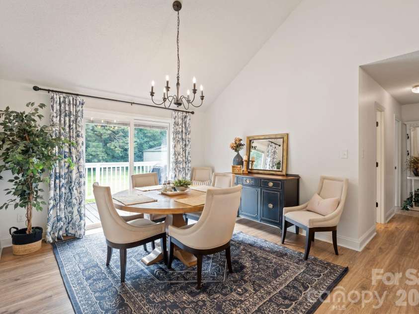 6168 King Wilkinson Road, Denver, NC 28037.  MLS# CAR4395555, YatesRealty ID 33896. Cozy dining area with a backyard view 