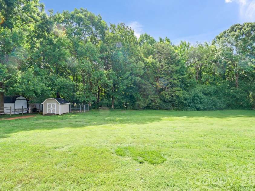 6168 King Wilkinson Road, Denver, NC 28037.  MLS# CAR4395555, YatesRealty ID 33896. Expansive treelined backyard 