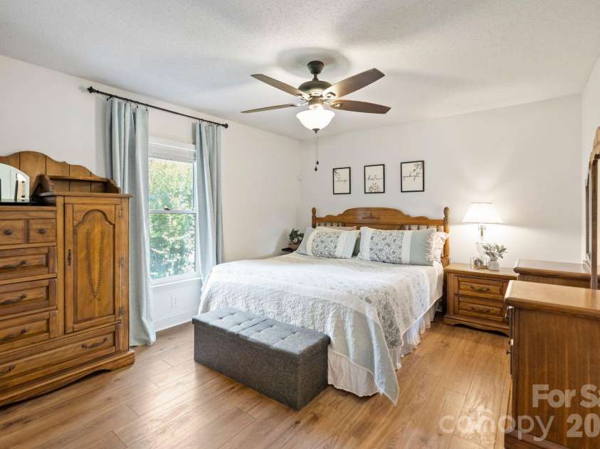 6168 King Wilkinson Road, Denver, NC 28037.  MLS# CAR4395555, YatesRealty ID 33896. Spacious primary bedroom with private bathroom