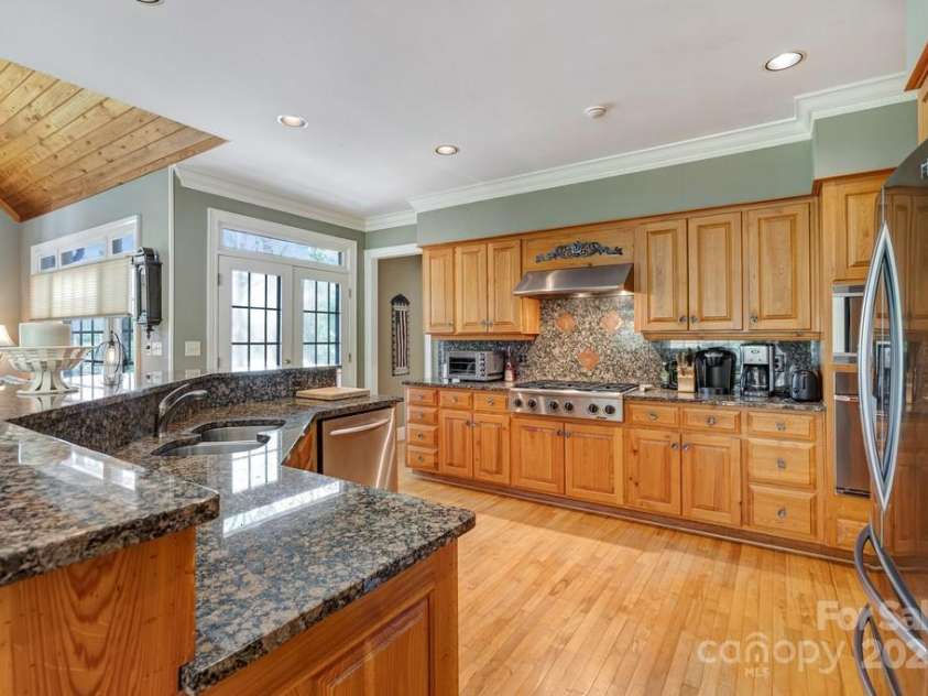 201 Hughes Creek, Columbus, NC 28722.  MLS# CAR4259120, YatesRealty ID 339. Kitchen with granite counters and Dacor appliances