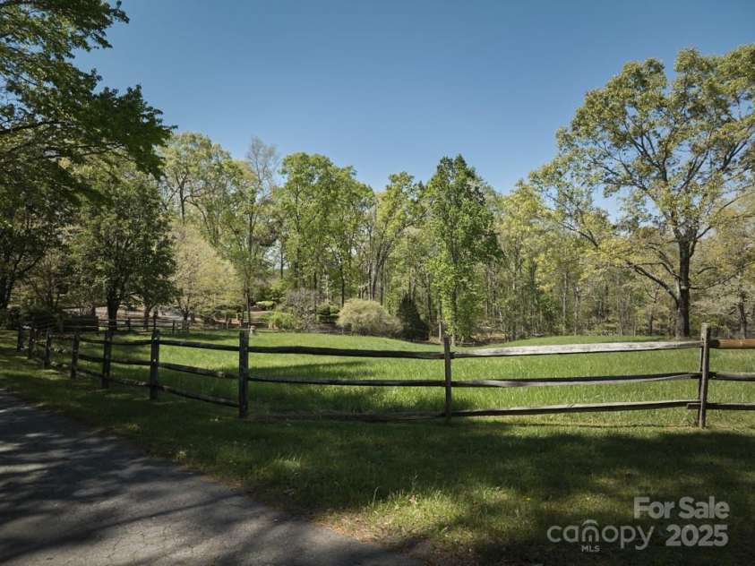 201 Hughes Creek, Columbus, NC 28722.  MLS# CAR4259120, YatesRealty ID 339. One of 3 large paddocks. Gorgeous park like setting with split rail fencing. 