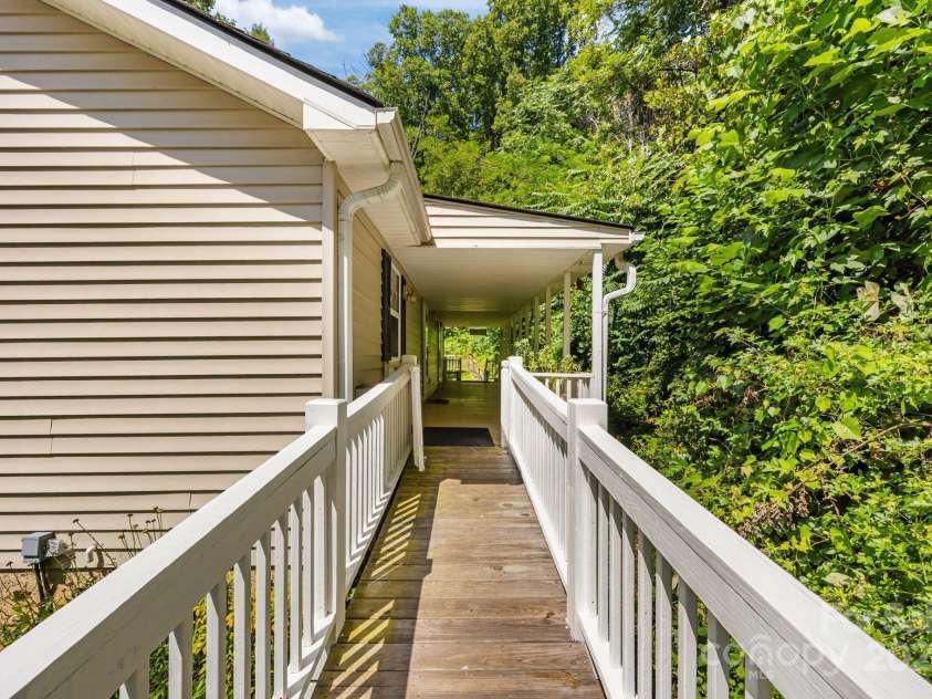 73 Waters Road, Asheville, NC 28805.  MLS# CAR4272719, YatesRealty ID 33907. Gate separating ADA Ramp to Covered Back Porch