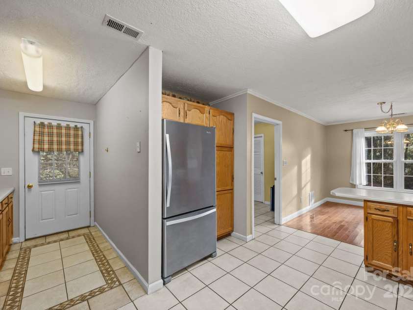 73 Waters Road, Asheville, NC 28805.  MLS# CAR4272719, YatesRealty ID 33907. Wrap-Around Kitchen leading to covered back porch for peaceful mornings.