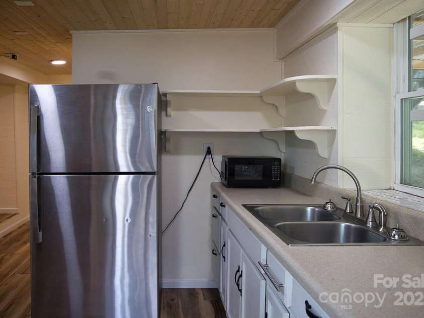 107 Riverview Drive, Asheville, NC 28806.  MLS# CAR4275298, YatesRealty ID 33909. Basement Kitchen