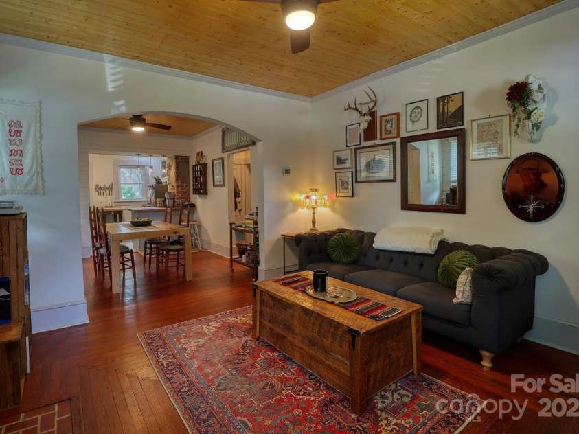 107 Riverview Drive, Asheville, NC 28806.  MLS# CAR4275298, YatesRealty ID 33909. Cozy Living Room with Original Ornate Hardwood Floors