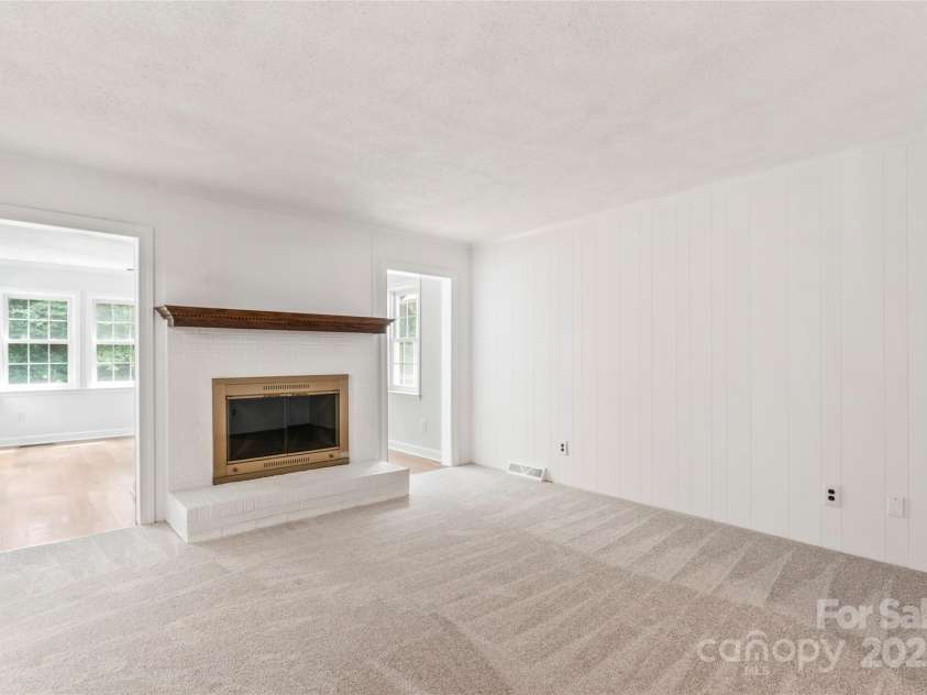 5812 Chapel Creek Court, Charlotte, NC 28226.  MLS# CAR4293995, YatesRealty ID 33915. Family room with log burning fireplace