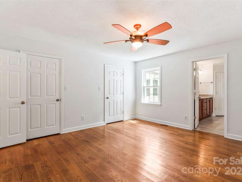 5812 Chapel Creek Court, Charlotte, NC 28226.  MLS# CAR4293995, YatesRealty ID 33915. Primary Bedroom with his and hers walk-in closets