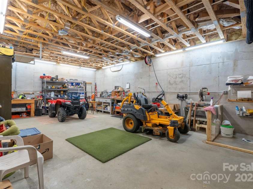 55 Lake Drive, Fairview, NC 28730.  MLS# CAR4272386, YatesRealty ID 33918. Huge storage/workroom could easily be converted to living space