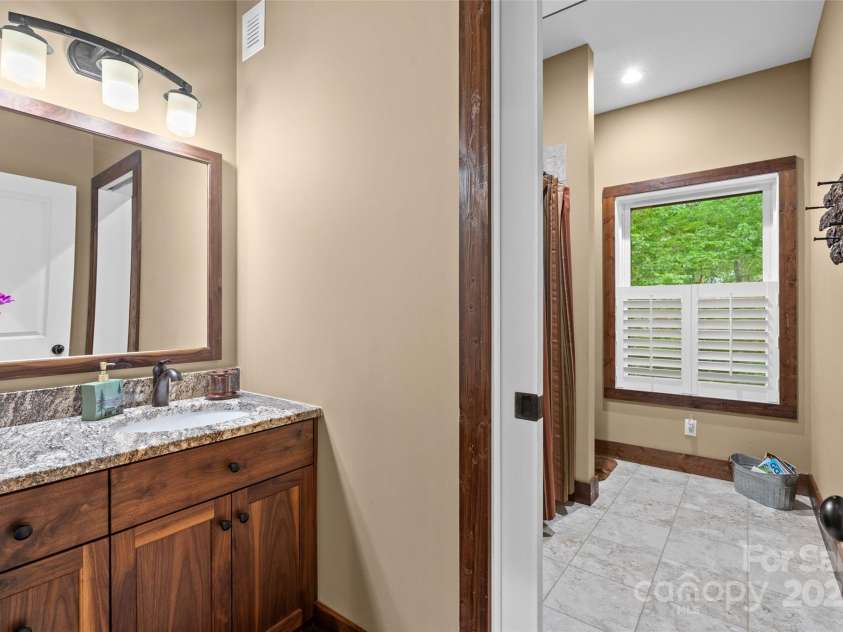 55 Lake Drive, Fairview, NC 28730.  MLS# CAR4272386, YatesRealty ID 33918. Large bathroom in basement