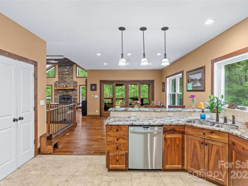 55 Lake Drive, Fairview, NC 28730.  MLS# CAR4272386, YatesRealty ID 33918. Open floor plan leads into expansive kitchen