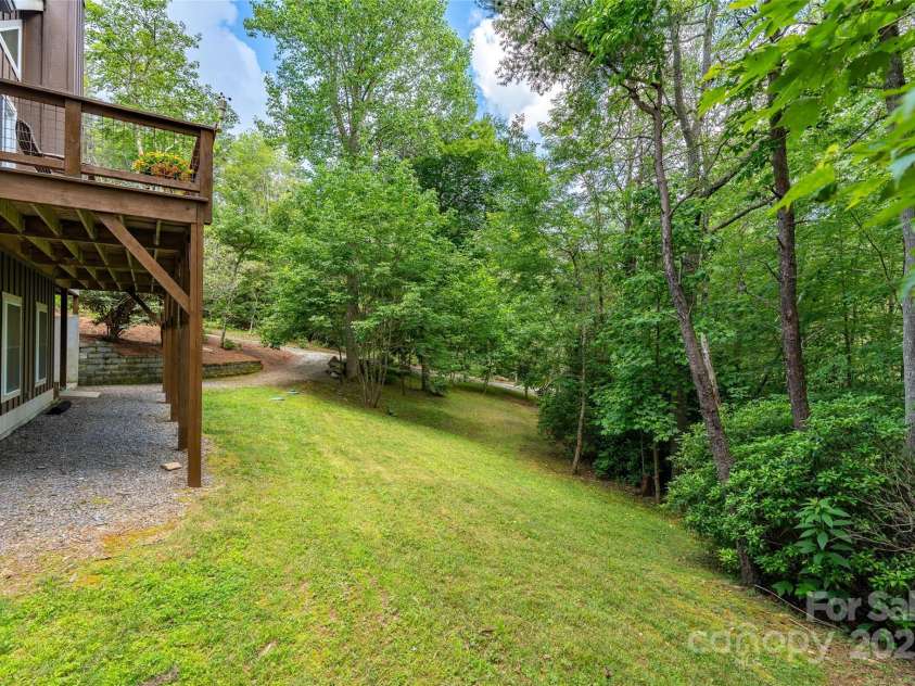 55 Lake Drive, Fairview, NC 28730.  MLS# CAR4272386, YatesRealty ID 33918. Quiet back yard at the end of cul de sac