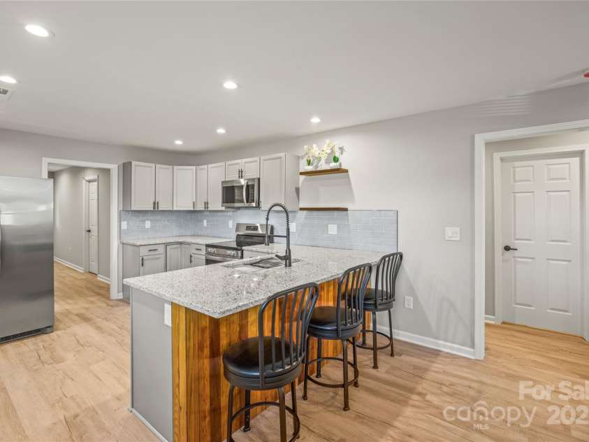 107 Poplar Street, Stanley, NC 28164.  MLS# CAR4246663, YatesRealty ID 33926. Floors are not brown.  They are light Grey