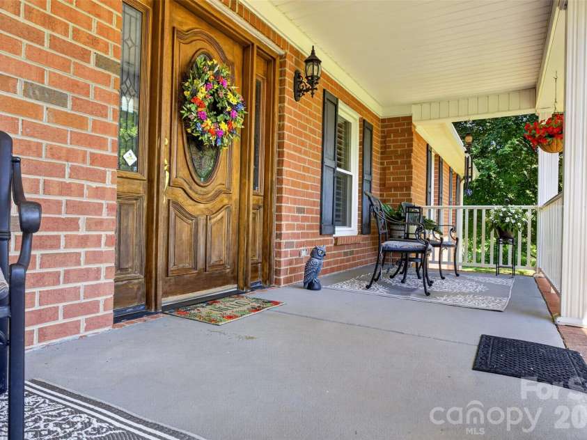 8234 Dennis Road, Charlotte, NC 28227.  MLS# CAR4390277, YatesRealty ID 33931. Front porch