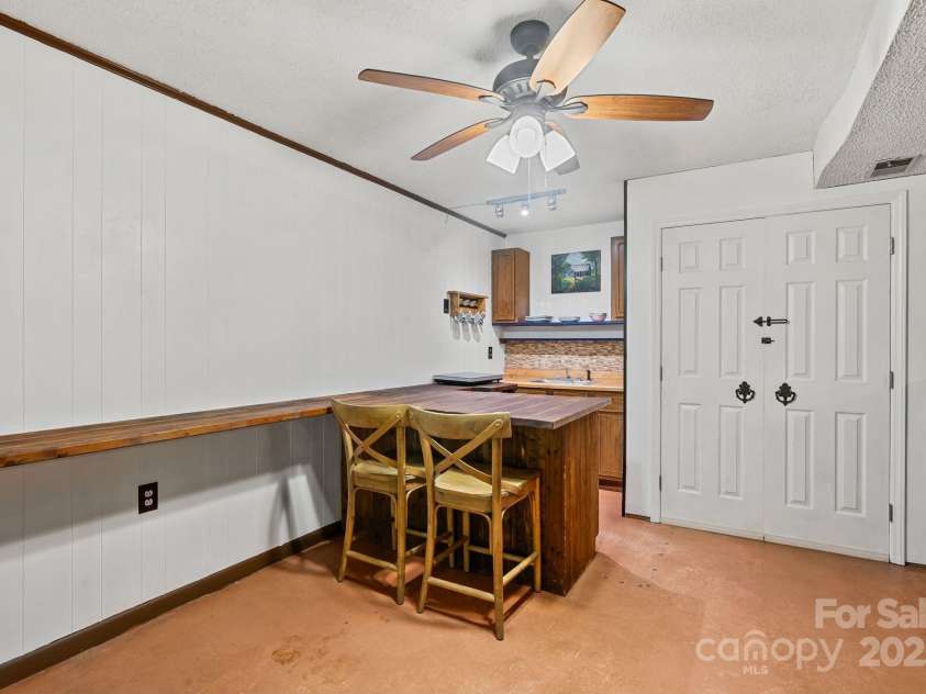 19 Mountain Brook Drive, Candler, NC 28715.  MLS# CAR4286834, YatesRealty ID 33932. Built in kitchenette on lower level