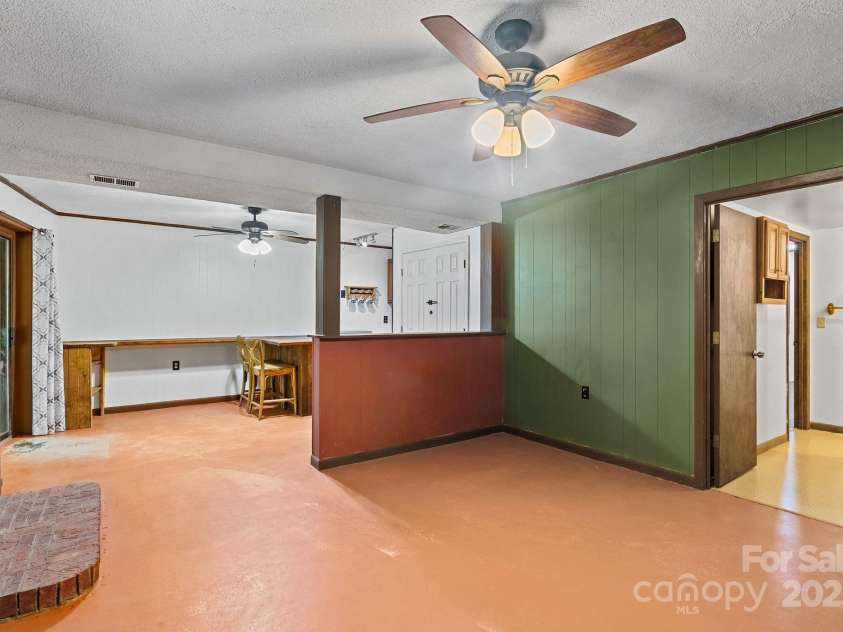 19 Mountain Brook Drive, Candler, NC 28715.  MLS# CAR4286834, YatesRealty ID 33932. Concrete floors. Lots of options for the space