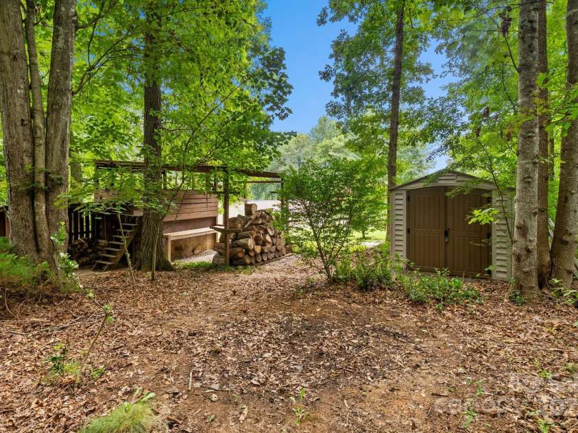 19 Mountain Brook Drive, Candler, NC 28715.  MLS# CAR4286834, YatesRealty ID 33932. Storage shed, playhouse, and kayak storage rack included