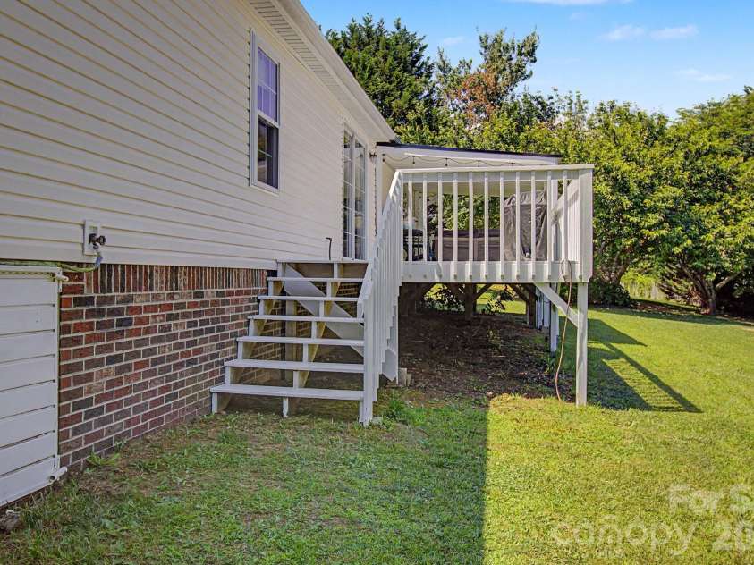 22 Sweet Briar Path Way, Hendersonville, NC 28792.  MLS# CAR4396421, YatesRealty ID 33933. Back deck in stairs