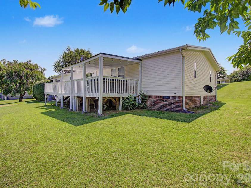 22 Sweet Briar Path Way, Hendersonville, NC 28792.  MLS# CAR4396421, YatesRealty ID 33933. Back oblique of home