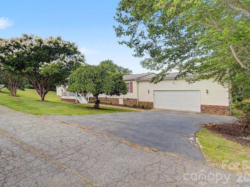 22 Sweet Briar Path Way, Hendersonville, NC 28792.  MLS# CAR4396421, YatesRealty ID 33933. Front with oversized two car garage