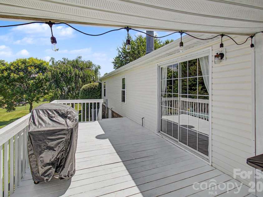 22 Sweet Briar Path Way, Hendersonville, NC 28792.  MLS# CAR4396421, YatesRealty ID 33933. Partially covered back deck