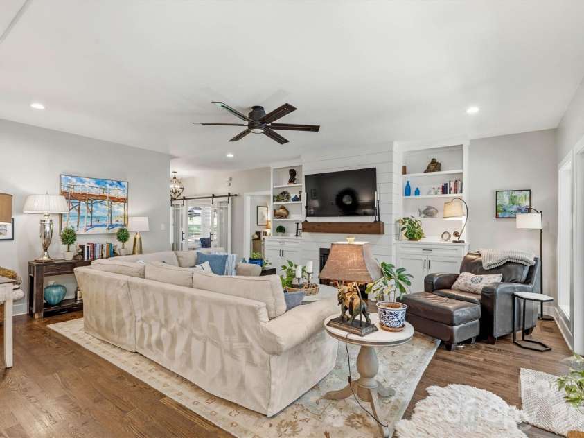 4975 Harbor View Drive, Granite Falls, NC 28630.  MLS# CAR4393944, YatesRealty ID 33937. Open Concept Great Room/Custom Built-Ins and Fireplace (Gas Logs) View