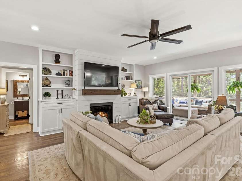 4975 Harbor View Drive, Granite Falls, NC 28630.  MLS# CAR4393944, YatesRealty ID 33937. Open Concept Great Room/Custom Built-Ins and Fireplace (Gas Logs) View