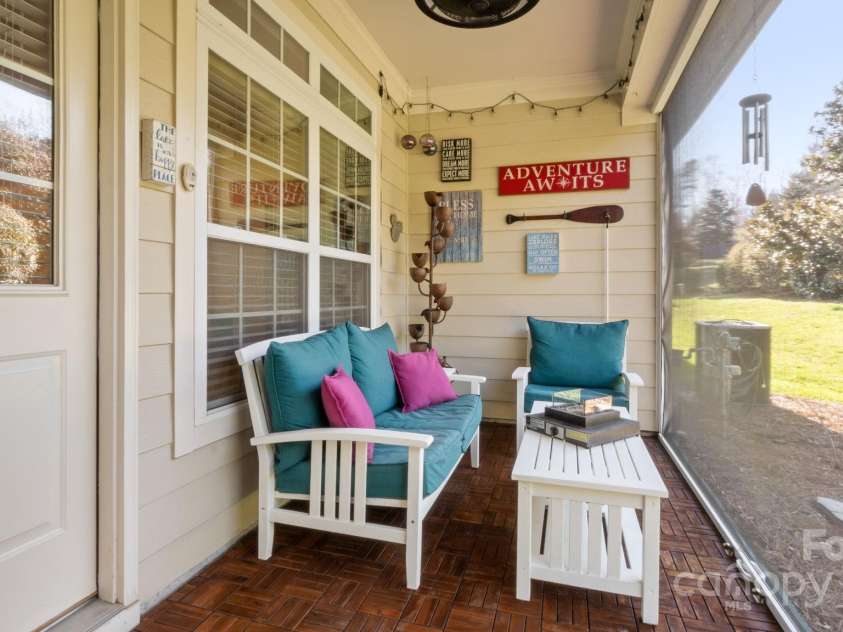 8534 Loxton Circle, Charlotte, NC 28214.  MLS# CAR4232602, YatesRealty ID 3394. Covered back porch with teak decking and vertically RETRACTABLE, locking screen!
