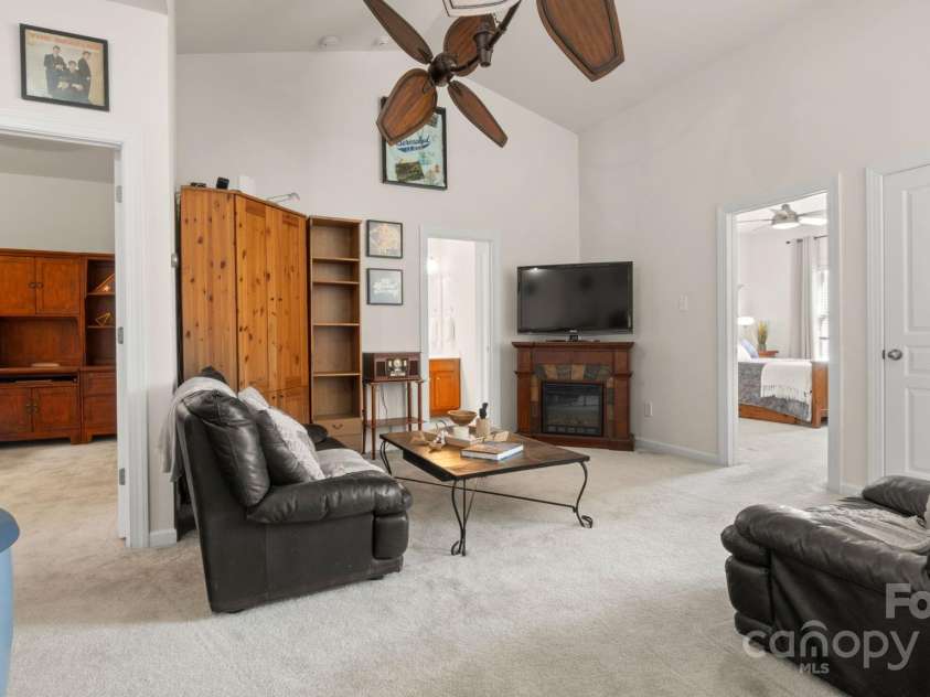 8534 Loxton Circle, Charlotte, NC 28214.  MLS# CAR4232602, YatesRealty ID 3394. Large loft space being used as 2nd living room. Perfect for entertaining! Leads to 2 upstairs bedroom, flex/office space, and full bathroom