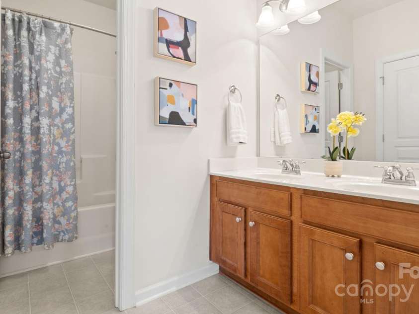 8534 Loxton Circle, Charlotte, NC 28214.  MLS# CAR4232602, YatesRealty ID 3394. Upstairs full bathroom is both an ensuite and has access from loft