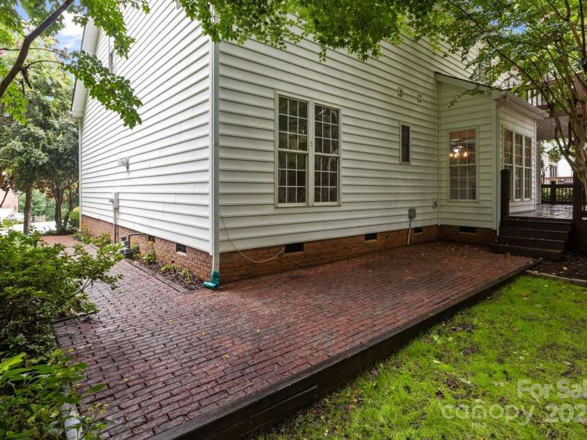 16923 Laureate Road, Huntersville, NC 28078.  MLS# CAR4286306, YatesRealty ID 33940. Brick walkway around the rear and side