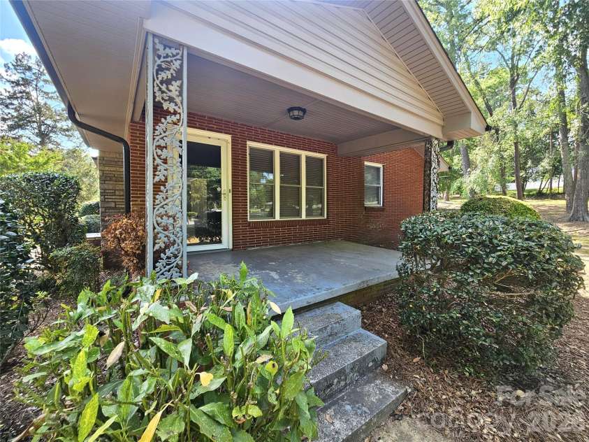 557 Goldmoor Drive, Concord, NC 28025.  MLS# CAR4385029, YatesRealty ID 33942. Side Porch