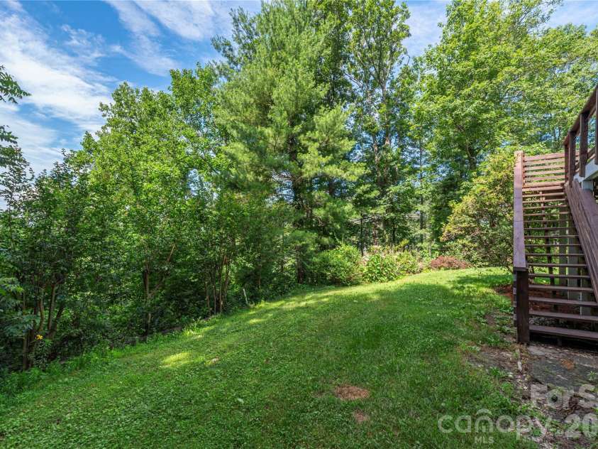 23 Moriah Lane, Asheville, NC 28803.  MLS# CAR4396349, YatesRealty ID 33943. Back yard connecting to main level deck.
