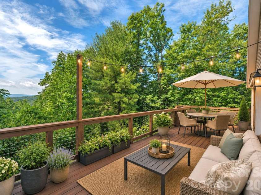 23 Moriah Lane, Asheville, NC 28803.  MLS# CAR4396349, YatesRealty ID 33943. South facing deck with views virtually staged.