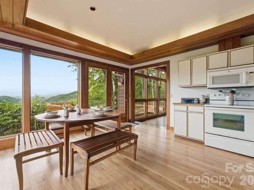 11150 Highway 19W Highway, Bryson City, NC 28713.  MLS# CAR4394806, YatesRealty ID 33948. Step up to the kitchen and take in the elevated views, custom built mahogany soffits with hidden lighting give the space a warm glow.