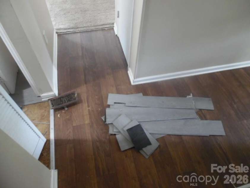 6311 Coach Hill Lane, Charlotte, NC 28212.  MLS# CAR4398478, YatesRealty ID 33964. Flooring Damage