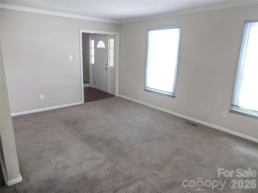 6311 Coach Hill Lane, Charlotte, NC 28212.  MLS# CAR4398478, YatesRealty ID 33964. Living Room (virtually staged)