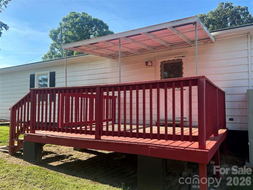 402 24TH Street, Kannapolis, NC 28083.  MLS# CAR4398330, YatesRealty ID 33965. Covered Back Deck Leading to the Fully Fenced Backyard