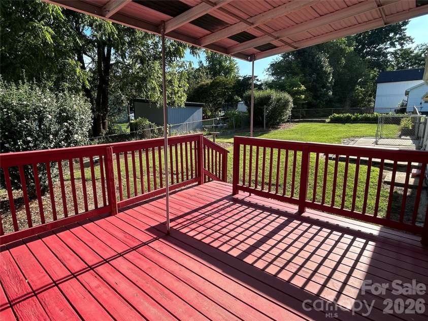 402 24TH Street, Kannapolis, NC 28083.  MLS# CAR4398330, YatesRealty ID 33965. Covered Back Deck Leading to the Fully Fenced Backyard