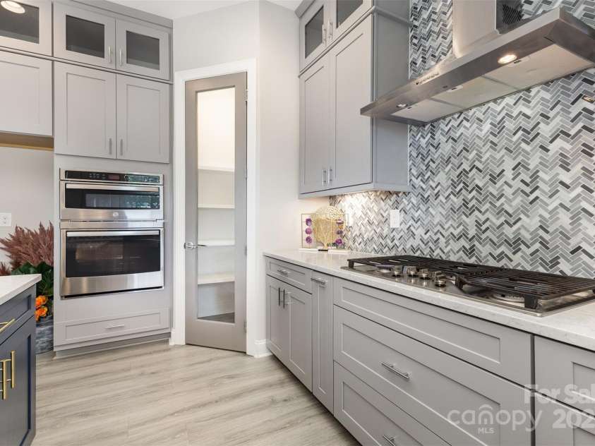 6059 Ancestry Trail, Indian Land, SC 29707.  MLS# CAR4289707, YatesRealty ID 33970. Gourmet kitchen with quartz & Monogram appliances