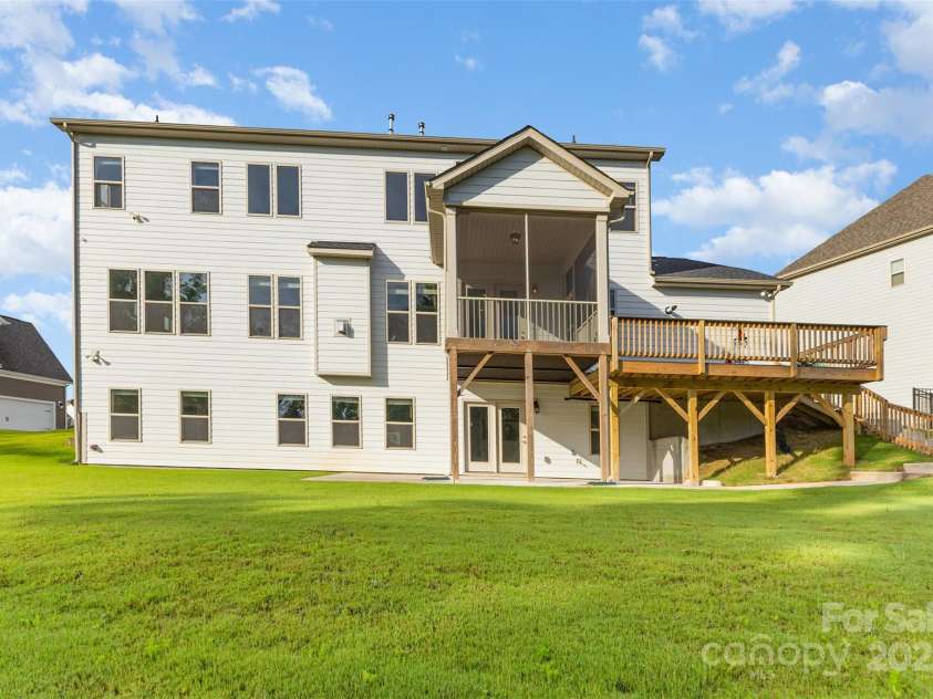 6059 Ancestry Trail, Indian Land, SC 29707.  MLS# CAR4289707, YatesRealty ID 33970. Private wooded backyard with Trex decks