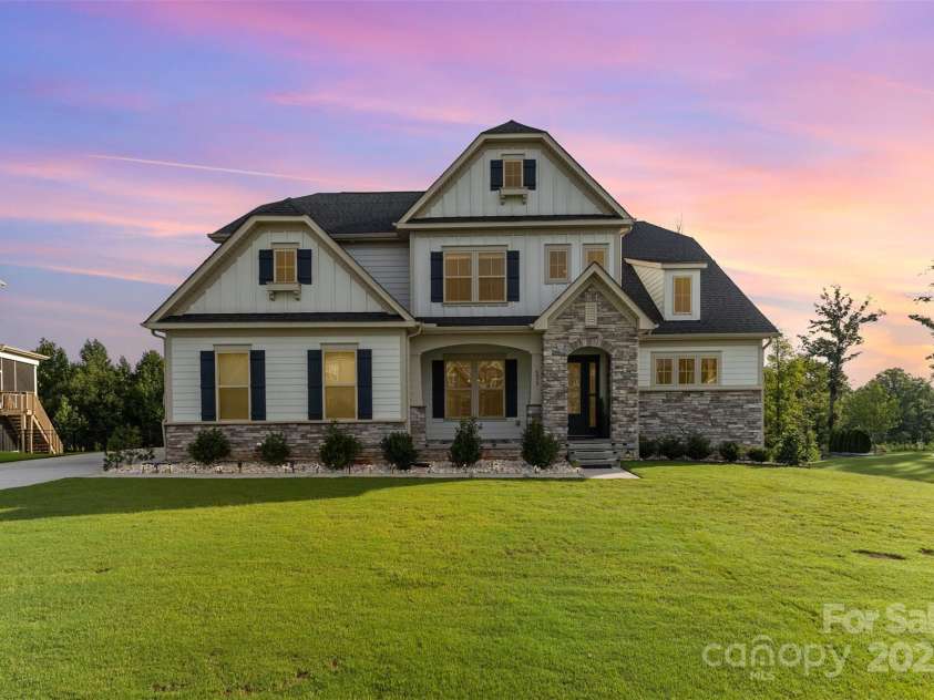 6059 Ancestry Trail, Indian Land, SC 29707.  MLS# CAR4289707, YatesRealty ID 33970. Twilight front exterior