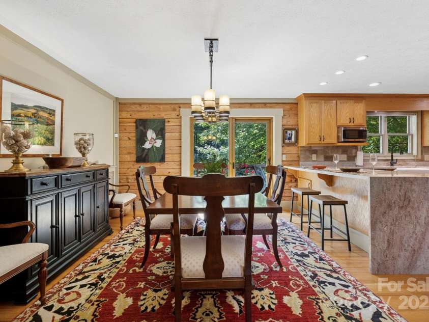 85 Rock Rest Road, Hendersonville, NC 28739.  MLS# CAR4282137, YatesRealty ID 33979. Dining area open to newly updated kitchen with handsome granite
