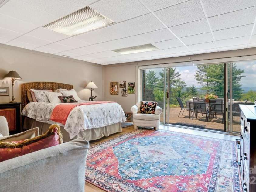85 Rock Rest Road, Hendersonville, NC 28739.  MLS# CAR4282137, YatesRealty ID 33979. Light filled bonus/family room with views!