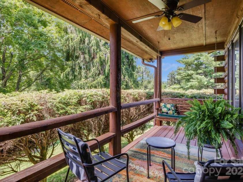 85 Rock Rest Road, Hendersonville, NC 28739.  MLS# CAR4282137, YatesRealty ID 33979. Porch swing on guest room deck