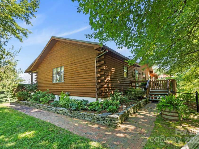 85 Rock Rest Road, Hendersonville, NC 28739.  MLS# CAR4282137, YatesRealty ID 33979. Shady gardens and walk way