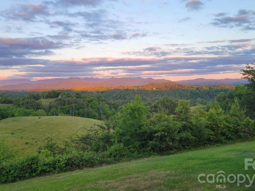 1091 WINDSWEPT RIDGE Road, Marshall, NC 28753.  MLS# CAR4393811, YatesRealty ID 33980. Front Porch view-Can you hear the day ending??