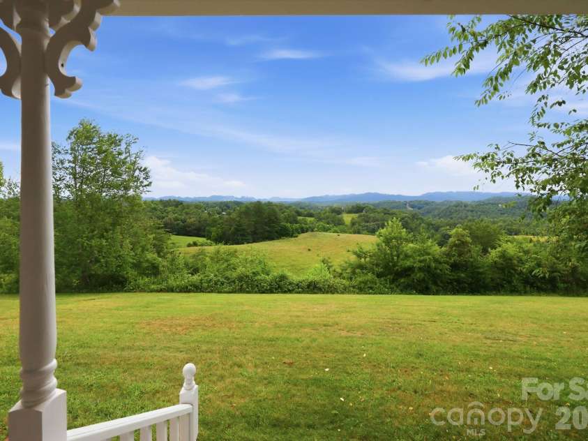 1091 WINDSWEPT RIDGE Road, Marshall, NC 28753.  MLS# CAR4393811, YatesRealty ID 33980. Front Porch view from your rocking chair