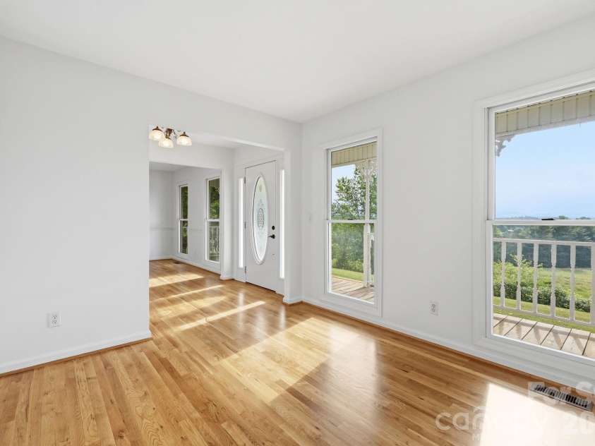 1091 WINDSWEPT RIDGE Road, Marshall, NC 28753.  MLS# CAR4393811, YatesRealty ID 33980. Front views from Left side-open to DR