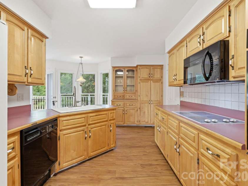 1091 WINDSWEPT RIDGE Road, Marshall, NC 28753.  MLS# CAR4393811, YatesRealty ID 33980. View of kitchen from DR