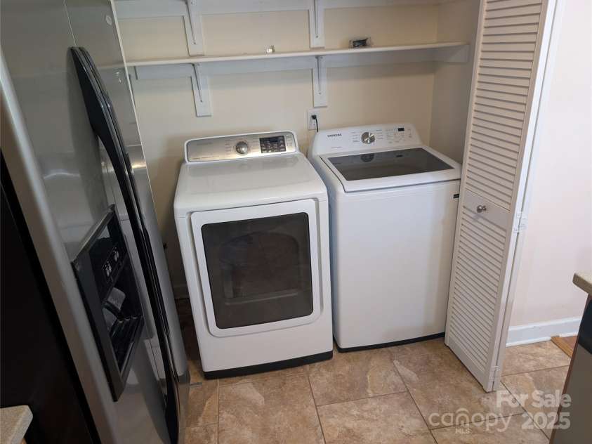 9221 Vicksburg Park Court, Charlotte, NC 28210.  MLS# CAR4289811, YatesRealty ID 34008. Laundry in kitchen